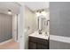 Bathroom with vanity, modern fixtures, and stylish wall mirror and lighting at 625 N Halifax Ave # 11, Daytona Beach, FL 32118