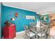Cozy dining room featuring hardwood floors, a modern table set and stylish decor at 625 N Halifax Ave # 11, Daytona Beach, FL 32118