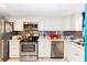 Bright, functional kitchen featuring stainless steel appliances, modern backsplash, and ample counter space at 625 N Halifax Ave # 11, Daytona Beach, FL 32118