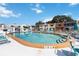 Outdoor pool features clear water, a well-maintained deck, and lounge chairs for relaxation in a community setting at 625 N Halifax Ave # 11, Daytona Beach, FL 32118