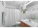 Well-lit bathroom featuring a shower-tub combo and modern vanity at 700 Spring Cavern Ave, Orange City, FL 32763