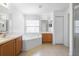 Spacious bathroom featuring double vanities and a large soaking tub at 700 Spring Cavern Ave, Orange City, FL 32763