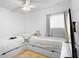 Shared bedroom with two twin beds and built-in storage at 700 Spring Cavern Ave, Orange City, FL 32763