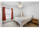 Cozy bedroom featuring a queen bed, natural light, and minimalist decor at 700 Spring Cavern Ave, Orange City, FL 32763