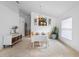 Dining room with a table setting and decor next to a storage cabinet at 700 Spring Cavern Ave, Orange City, FL 32763