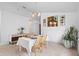 Dining room features a table setting and decor with art on the wall at 700 Spring Cavern Ave, Orange City, FL 32763