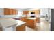 Kitchen featuring white countertops, a central island, and stainless steel microwave at 700 Spring Cavern Ave, Orange City, FL 32763