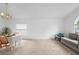 The carpeted living space features a dining area and comfortable seating at 700 Spring Cavern Ave, Orange City, FL 32763