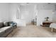 Neutral living room features a bench, carpet flooring, and comfortable seating at 700 Spring Cavern Ave, Orange City, FL 32763