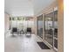 Covered patio with tiled floor and outdoor furniture at 700 Spring Cavern Ave, Orange City, FL 32763