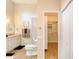Bathroom featuring modern fixtures, neutral color palette and an open door to the closet at 706 Fox Tail Ct, New Smyrna Beach, FL 32168