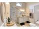 Bathroom featuring a glass-enclosed shower, dual vanities, and modern fixtures for a spa-like experience at 706 Fox Tail Ct, New Smyrna Beach, FL 32168