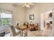 Spacious bedroom with desk, chairs, vaulted ceilings and wood laminate flooring at 706 Fox Tail Ct, New Smyrna Beach, FL 32168