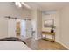 Bedroom featuring barn doors to closets, stylish console table and modern decorations at 706 Fox Tail Ct, New Smyrna Beach, FL 32168