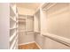 Closet featuring custom shelving, wood-look floors and ample space for storage and organization at 706 Fox Tail Ct, New Smyrna Beach, FL 32168