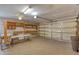 Spacious garage with shelving, work bench, and garage door opener, ready for projects and storage at 706 Fox Tail Ct, New Smyrna Beach, FL 32168
