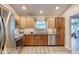 Updated kitchen features stainless steel appliances, granite countertops, and wood cabinetry at 706 Fox Tail Ct, New Smyrna Beach, FL 32168