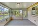 Enclosed lanai overlooking tranquil waterfront view and mature landscaping at 706 Fox Tail Ct, New Smyrna Beach, FL 32168