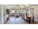 Bright and airy living room featuring vaulted ceilings, natural light, and a dining area at 706 Fox Tail Ct, New Smyrna Beach, FL 32168