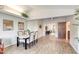 Open-concept dining and living area with seamless transitions and modern decor features at 706 Fox Tail Ct, New Smyrna Beach, FL 32168