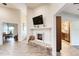 Open-concept space showing a fireplace and flow into the kitchen and office areas at 706 Fox Tail Ct, New Smyrna Beach, FL 32168