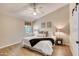 Serene bedroom with natural light, ceiling fan, and soothing color palette. Modern sliding door visible at 706 Fox Tail Ct, New Smyrna Beach, FL 32168
