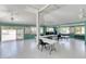 Large community meeting room with tables and chairs, perfect for events and activities at 706 Fox Tail Ct, New Smyrna Beach, FL 32168