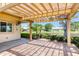 Covered patio with brick pavers, tranquil waterfront views, and lush landscaping at 706 Fox Tail Ct, New Smyrna Beach, FL 32168