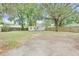 A large backyard with two storage sheds is perfect for outdoor activities and storage at 910 Sheeler Oaks Dr, Apopka, FL 32703