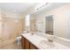 Bright bathroom featuring a double sink vanity and shower/tub at 910 Sheeler Oaks Dr, Apopka, FL 32703