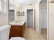 Bathroom featuring a double sink vanity with a closet at 910 Sheeler Oaks Dr, Apopka, FL 32703