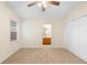 Bedroom with neutral carpet, a ceiling fan, and an ensuite bathroom at 910 Sheeler Oaks Dr, Apopka, FL 32703