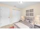 Comfortable bedroom with closet, neutral walls, and ample natural light at 910 Sheeler Oaks Dr, Apopka, FL 32703