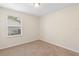Cozy bedroom boasts neutral walls, carpet, and window with natural lighting at 910 Sheeler Oaks Dr, Apopka, FL 32703