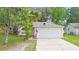 Charming single-story home with a two-car garage and well-maintained lawn at 910 Sheeler Oaks Dr, Apopka, FL 32703