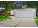 Charming single-story home with a two-car garage and well-maintained lawn at 910 Sheeler Oaks Dr, Apopka, FL 32703