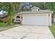 Charming single-story home with a two-car garage and well-maintained lawn at 910 Sheeler Oaks Dr, Apopka, FL 32703