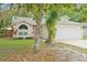 Charming single-story home with a two-car garage and well-maintained lawn at 910 Sheeler Oaks Dr, Apopka, FL 32703