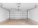 Spacious two-car garage featuring an automatic door opener and ample room for storage at 910 Sheeler Oaks Dr, Apopka, FL 32703