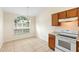 Cozy eat-in kitchen featuring a window with natural light and modern appliances at 910 Sheeler Oaks Dr, Apopka, FL 32703