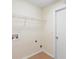The laundry room has tile flooring, a utility sink hookup, and door to the outside at 910 Sheeler Oaks Dr, Apopka, FL 32703