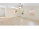 Inviting living room has tile flooring, two windows, and a ceiling fan at 910 Sheeler Oaks Dr, Apopka, FL 32703