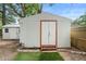 A storage shed sits in the backyard with freshly cut grass at 910 Sheeler Oaks Dr, Apopka, FL 32703