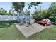 Backyard with a patio set on concrete pavers and a storage shed, plus a fun red toy car for the  at 920 Trafalgar St, Deltona, FL 32725
