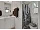 Well-lit bathroom with a double sink vanity, modern fixtures, and a separate shower area at 920 Trafalgar St, Deltona, FL 32725