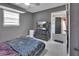 This contemporary bedroom features a sleek dresser with TV and a comfortable bed at 920 Trafalgar St, Deltona, FL 32725