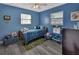 Bright bedroom features blue walls, playful decor, and a comfortable bed for a cozy space at 920 Trafalgar St, Deltona, FL 32725