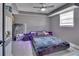 Modern bedroom with sleek furniture, a unique lighting fixture, and a comfortable bed at 920 Trafalgar St, Deltona, FL 32725