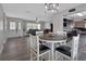 Inviting dining area with wood floors, modern lighting, and an open layout at 920 Trafalgar St, Deltona, FL 32725