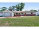 Charming single-story home with a well-maintained front yard and an attached single-car garage at 920 Trafalgar St, Deltona, FL 32725